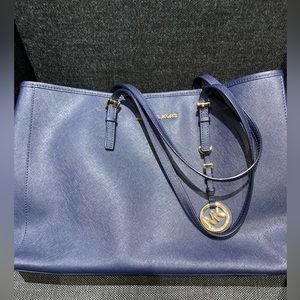 Michael Kors Purse. Dark Blue with gold toned hardware and logos.